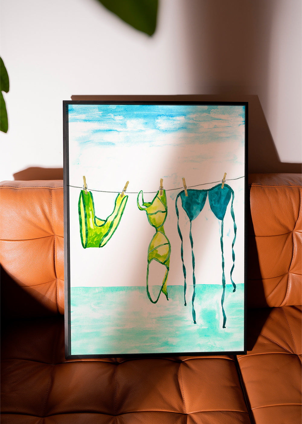 Illustration of hanging bikinis by the sea