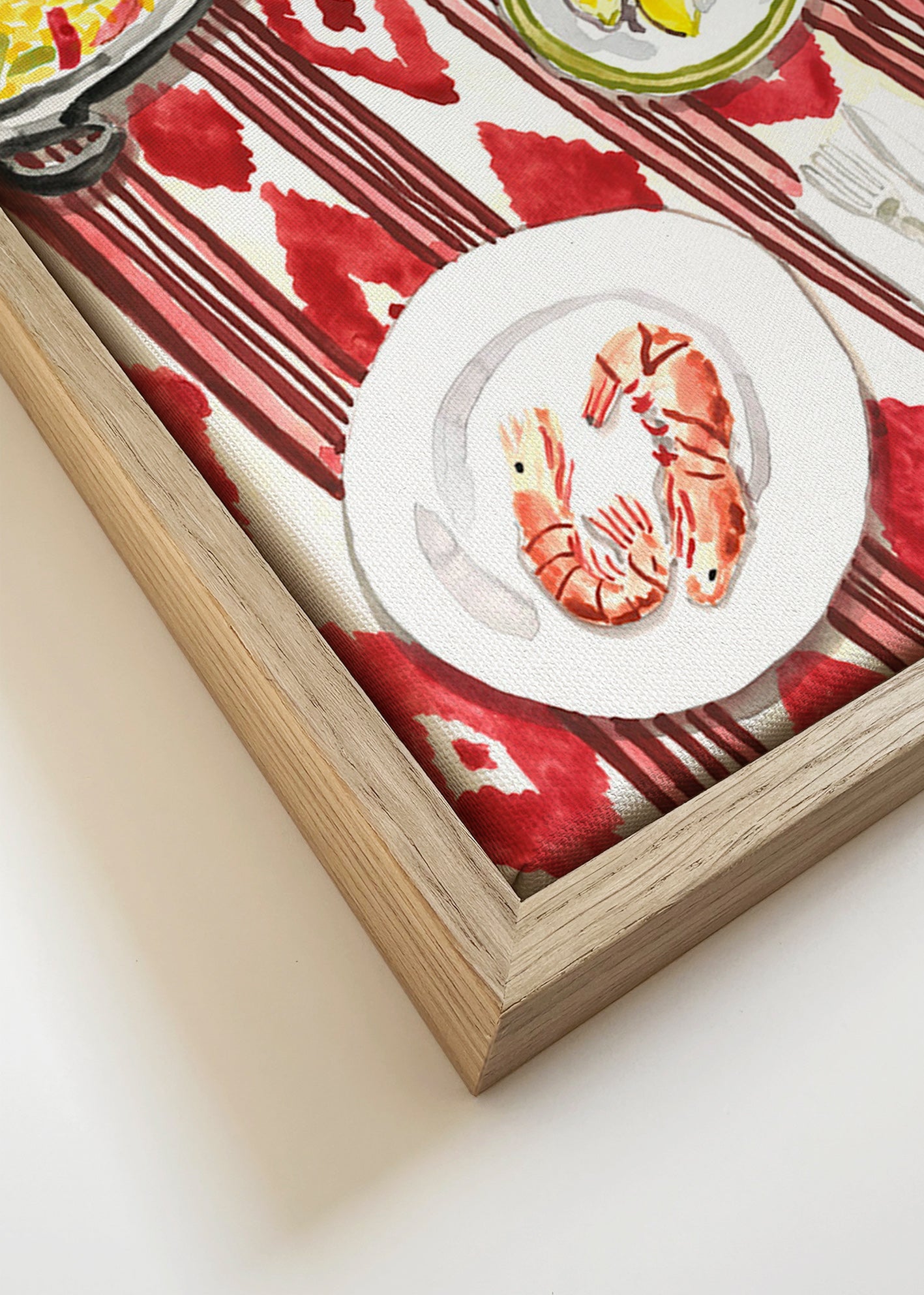 Kitchen art: paella and prawns on a patterned tablecloth
