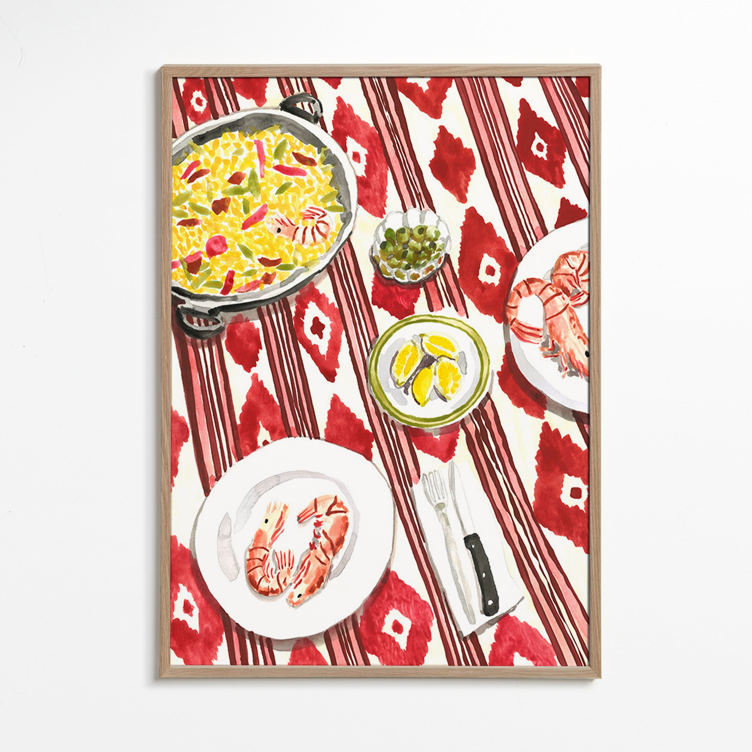 Kitchen art: paella and prawns on a patterned tablecloth