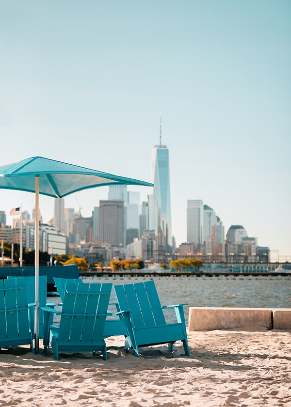 Travel poster with turquoise beach chairs and city skyline