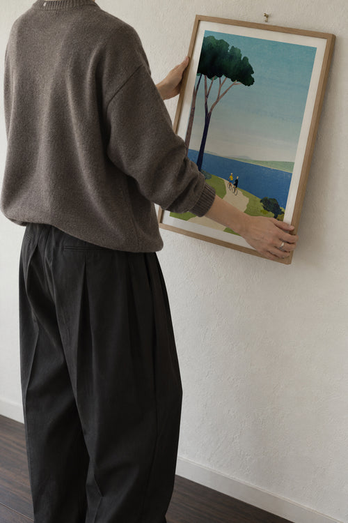 Cycling by the sea - Framed poster in an interior