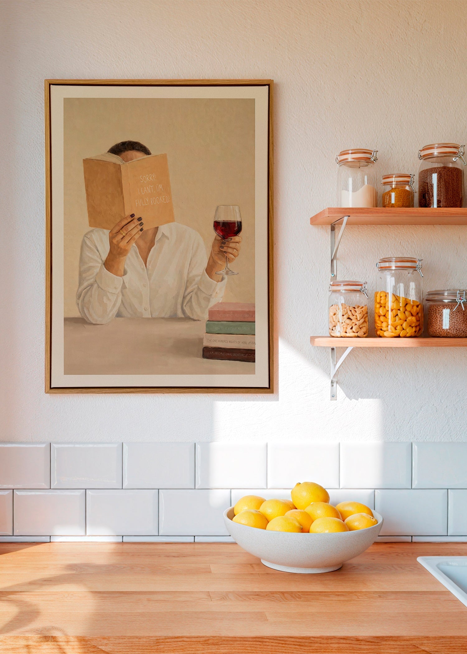 Kitchen art: woman reading with a glass of wine