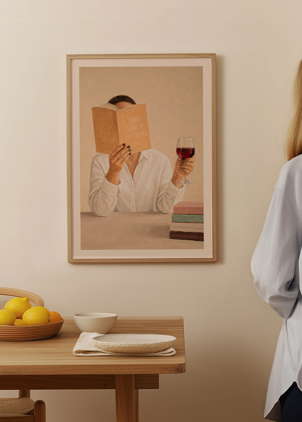 Kitchen art: woman reading with a glass of wine
