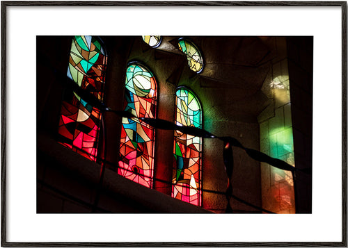 Photograph of stained glass windows in gothic interior