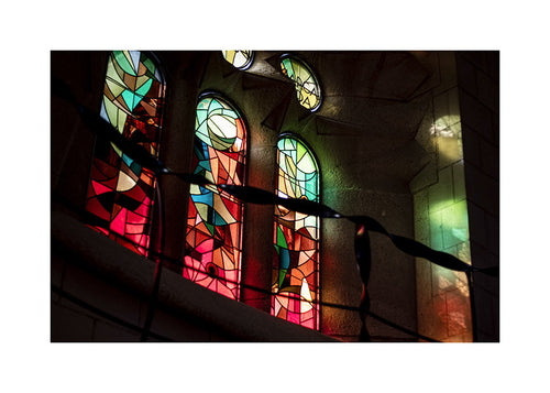 Photograph of stained glass windows in gothic interior