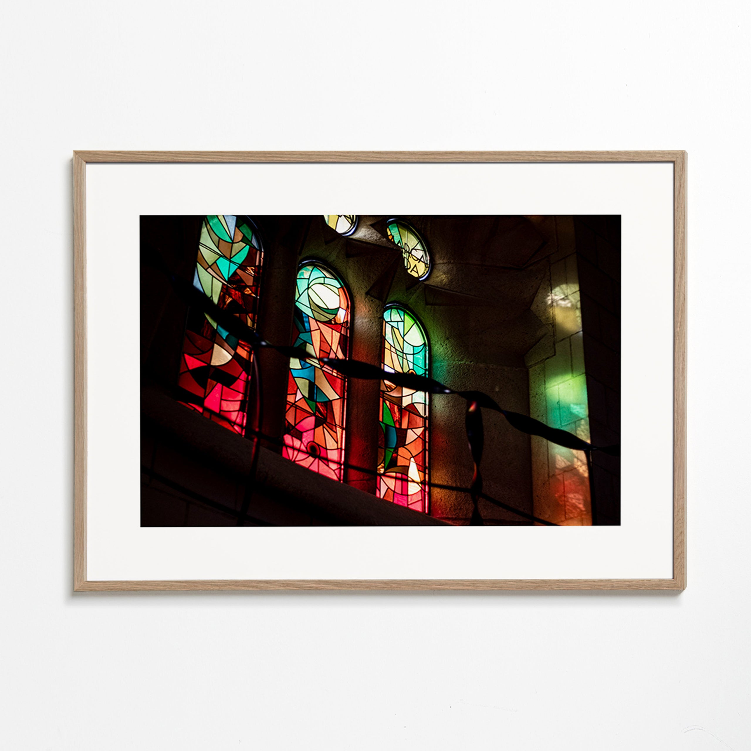 Photograph of stained glass windows in gothic interior