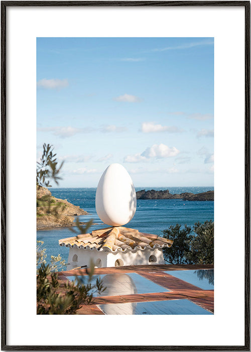 Landscape art with sculptural egg by the sea