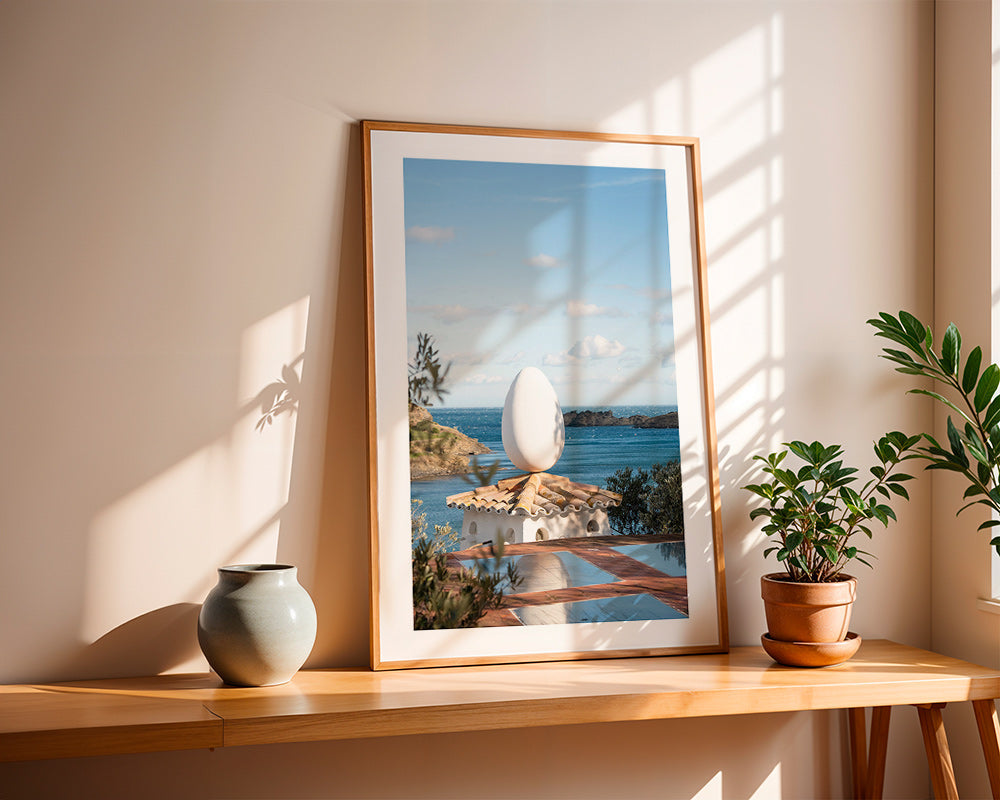 Landscape art with sculptural egg by the sea