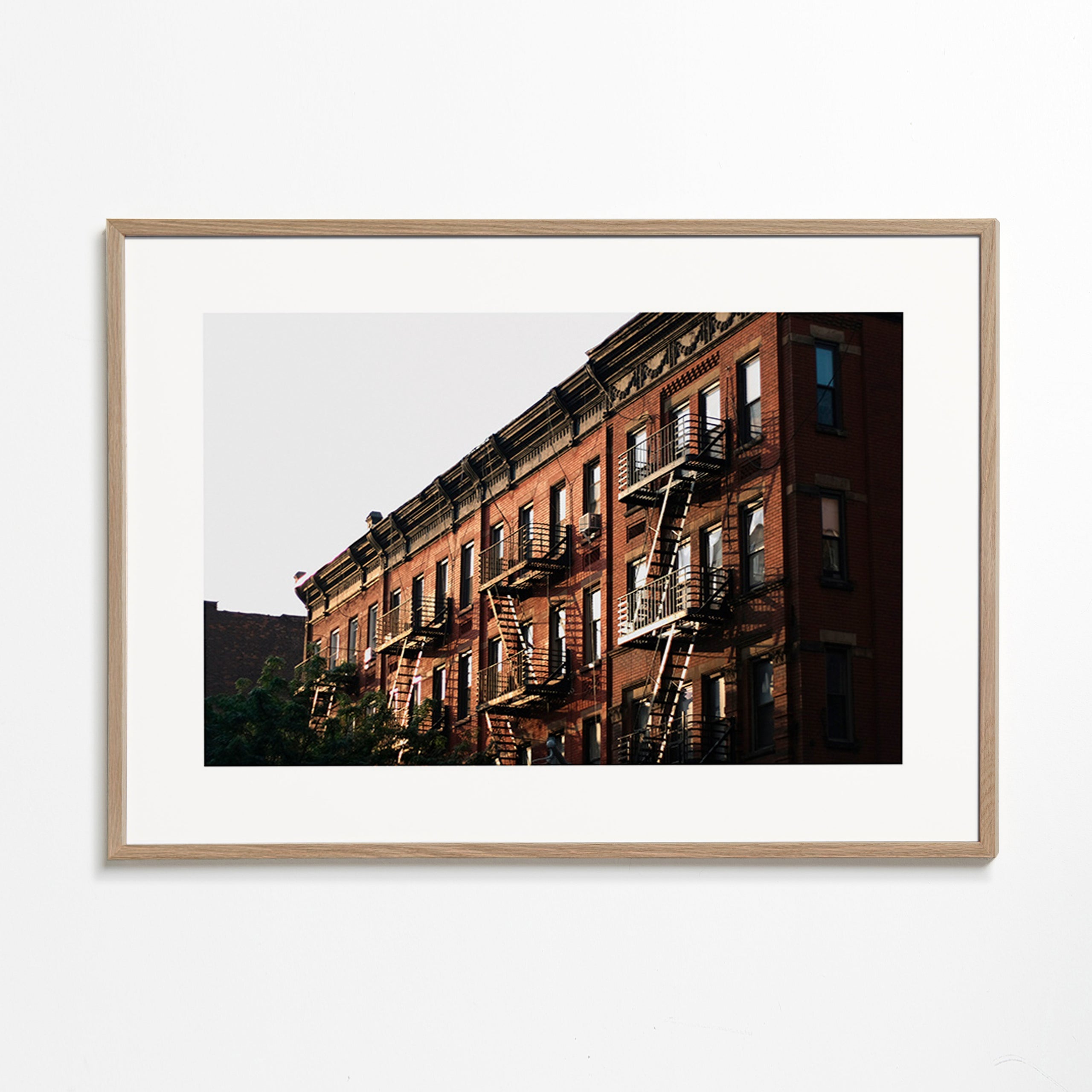 Travel poster: New York brownstone facade with fire escapes
