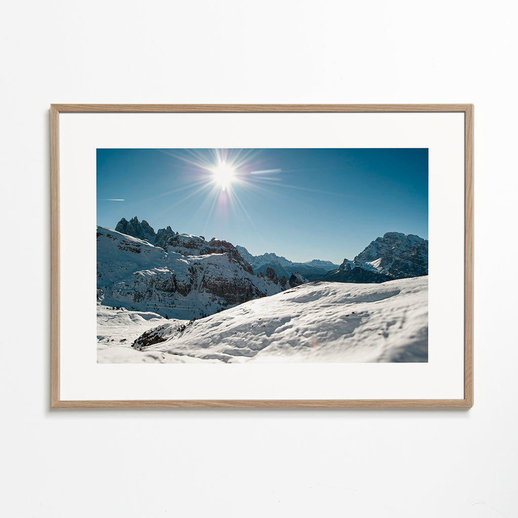 Landscape art: snowy mountain range under bright sun