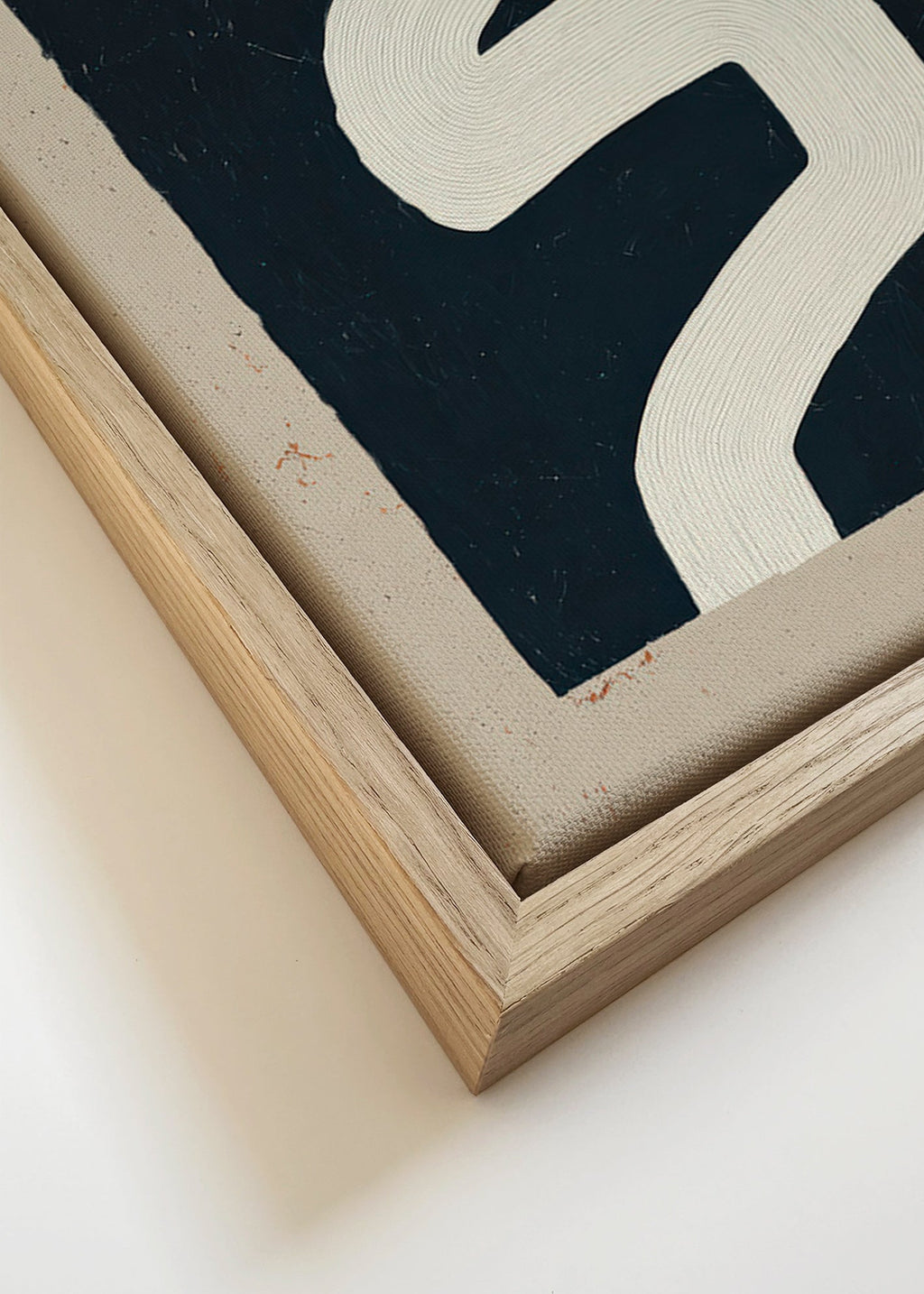 Minimalist print with a white curve on a dark panel