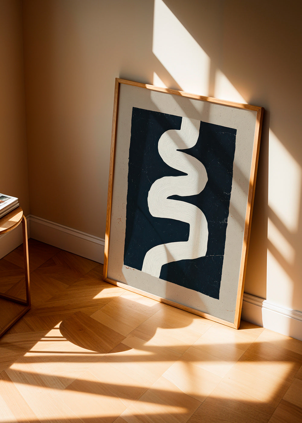 Minimalist print with a white curve on a dark panel