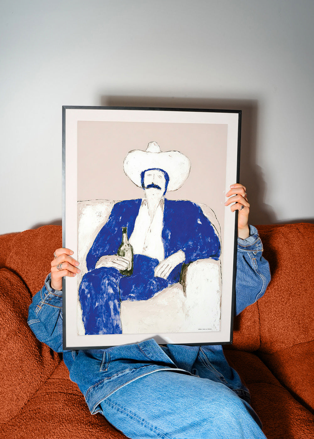 Illustration of seated blue cowboy