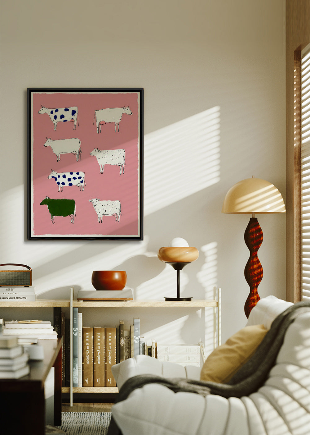 Artwork with playful cows on pink background