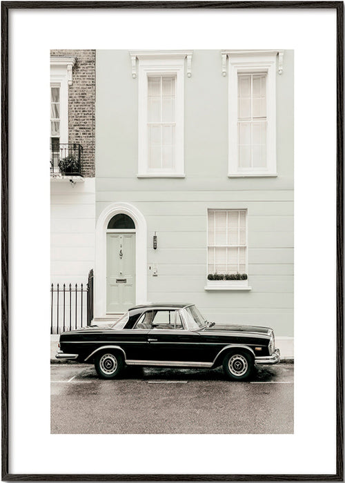 Vintage print classic car by a city facade