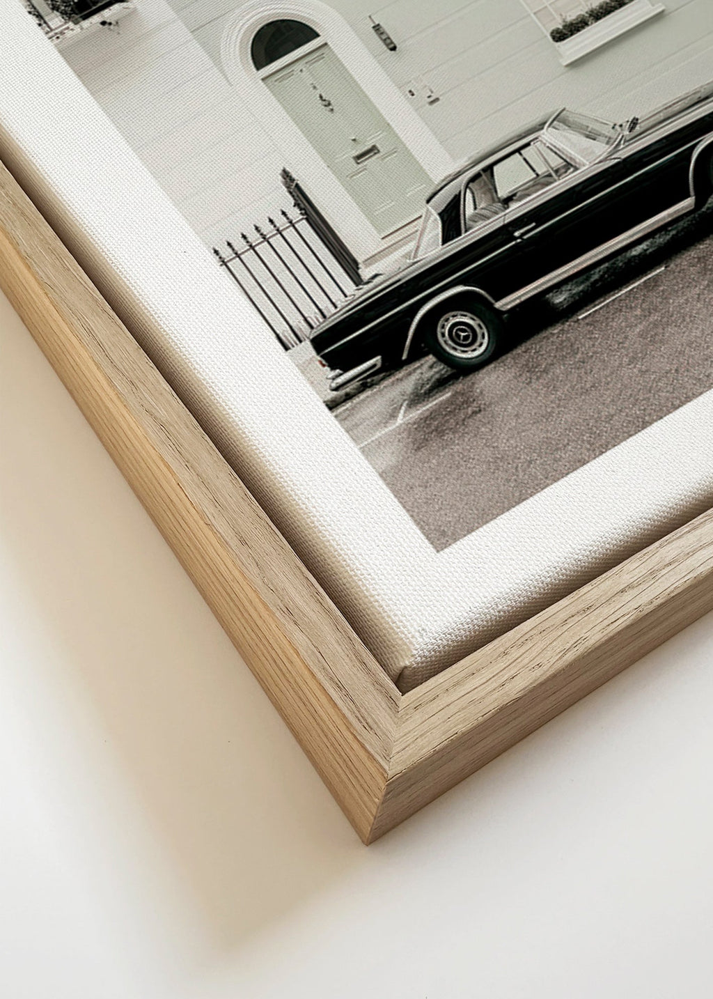 Vintage print classic car by a city facade