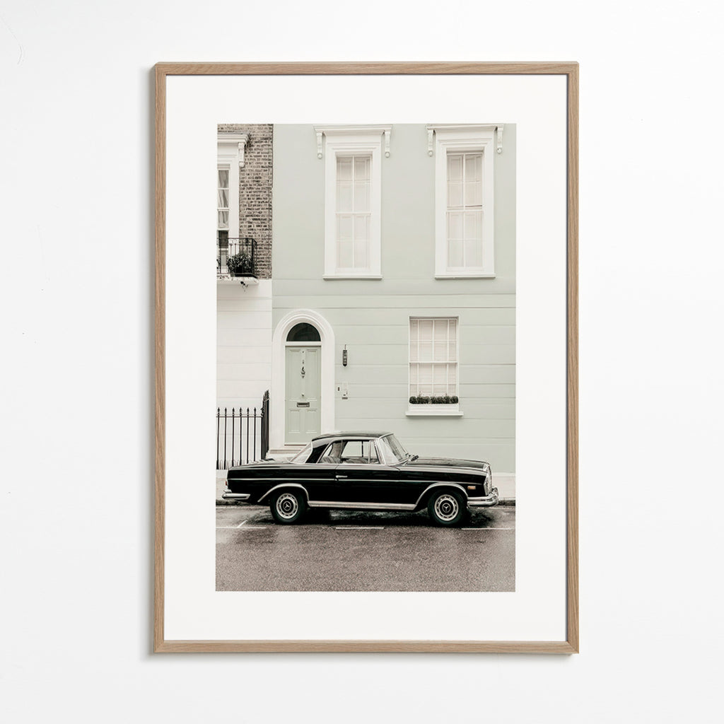 Vintage print classic car by a city facade