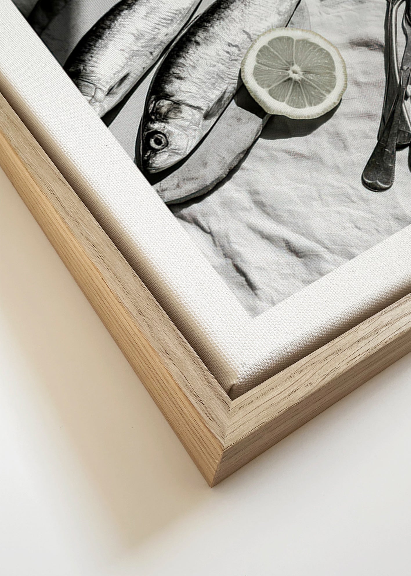 Kitchen art: monochrome sardines and lemon still life
