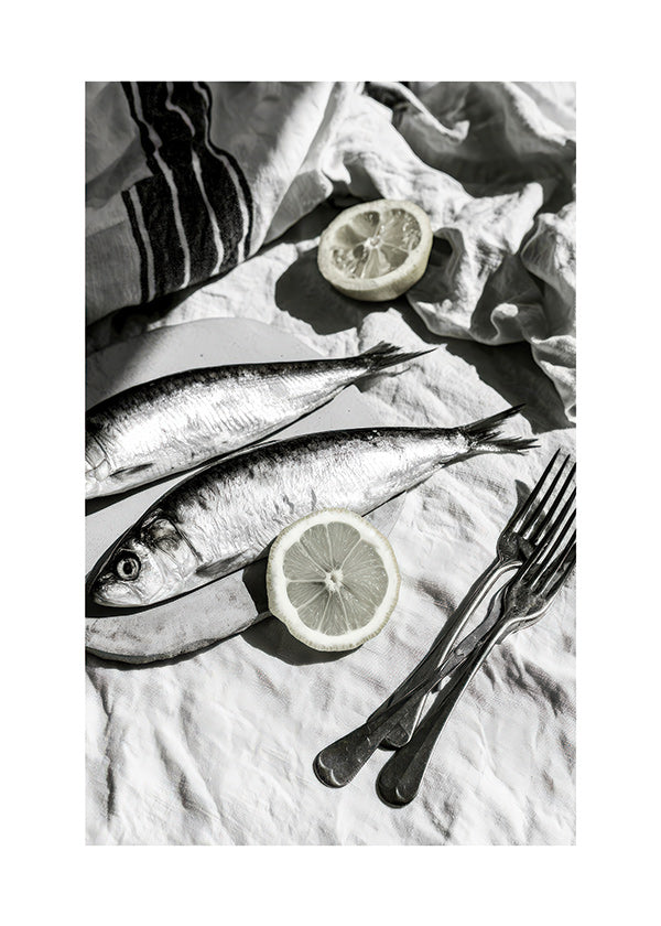 Kitchen art: monochrome sardines and lemon still life