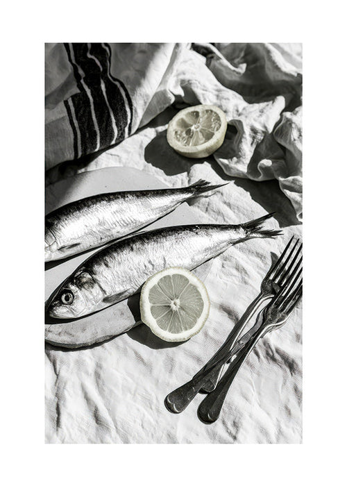 Kitchen art: monochrome sardines and lemon still life