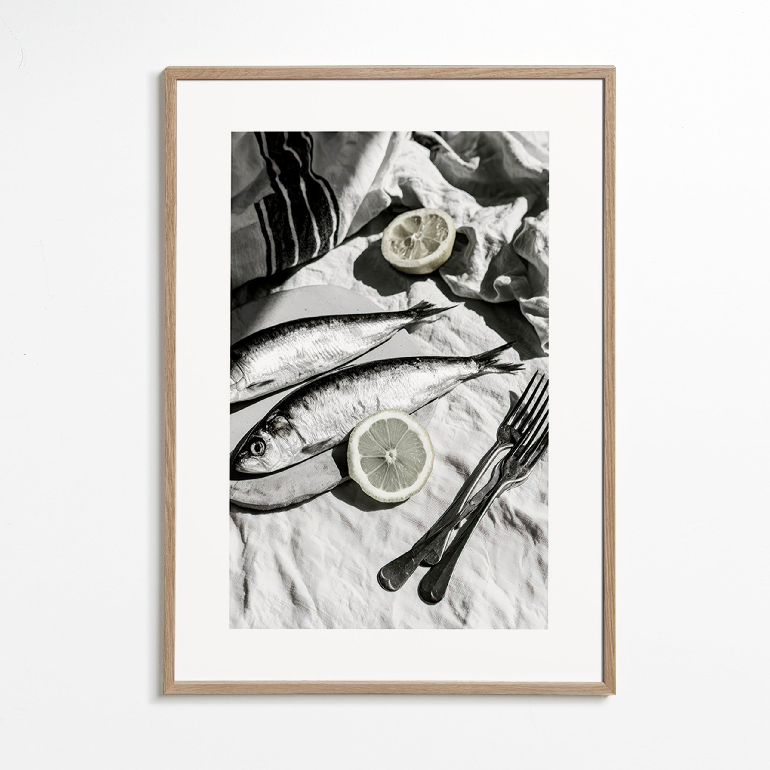 Kitchen art: monochrome sardines and lemon still life
