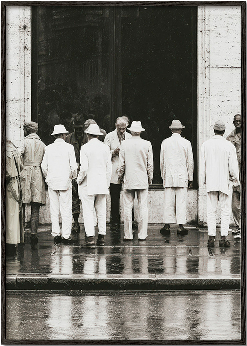 Black and white photo of men from the back in rain