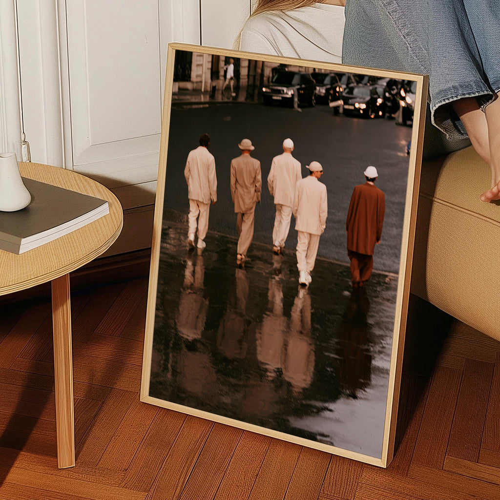 Photograph: five figures walking on a wet street