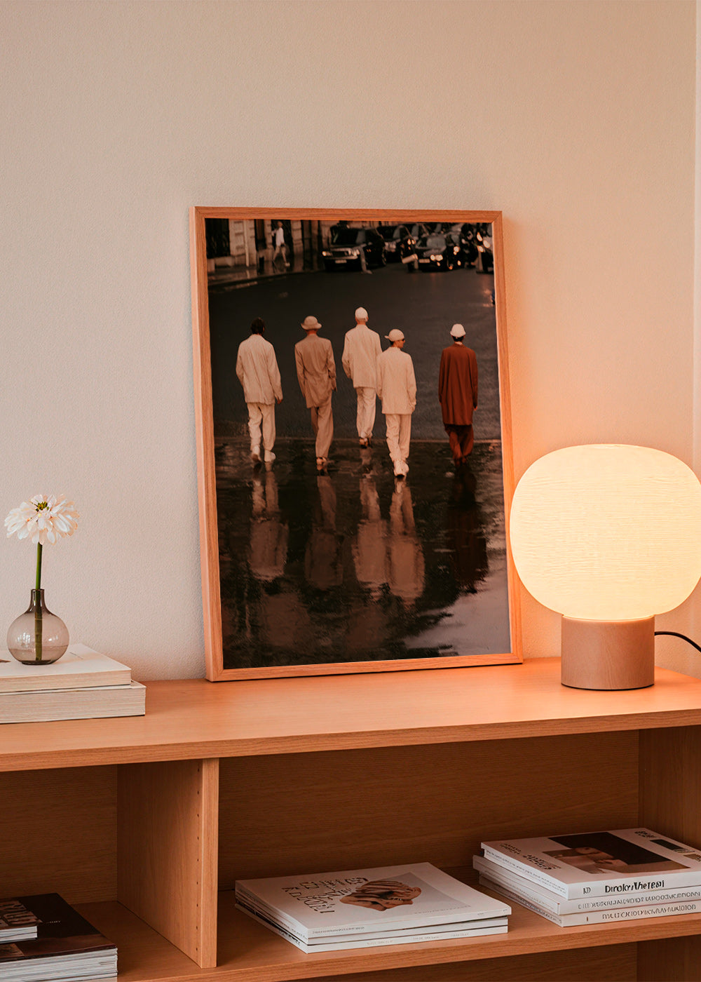Photograph: five figures walking on a wet street