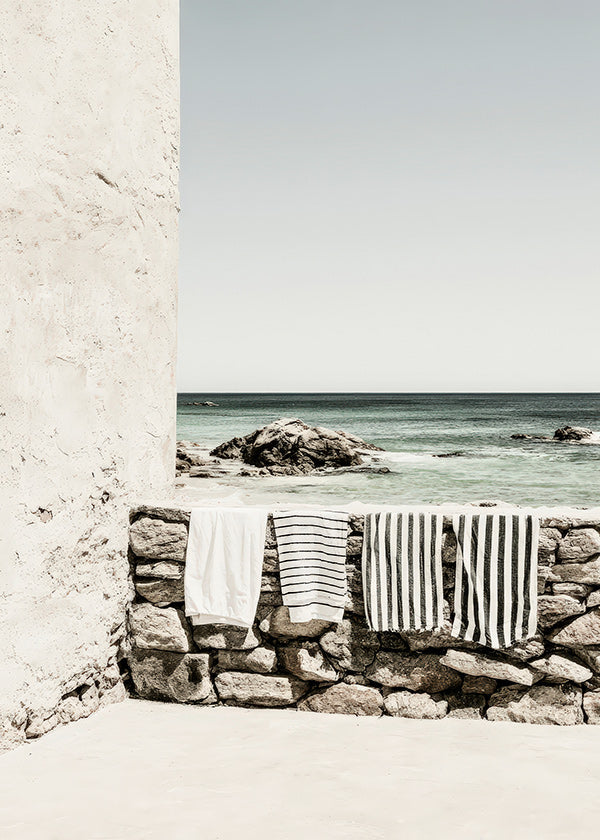 Coastal landscape photograph with hanging towels
