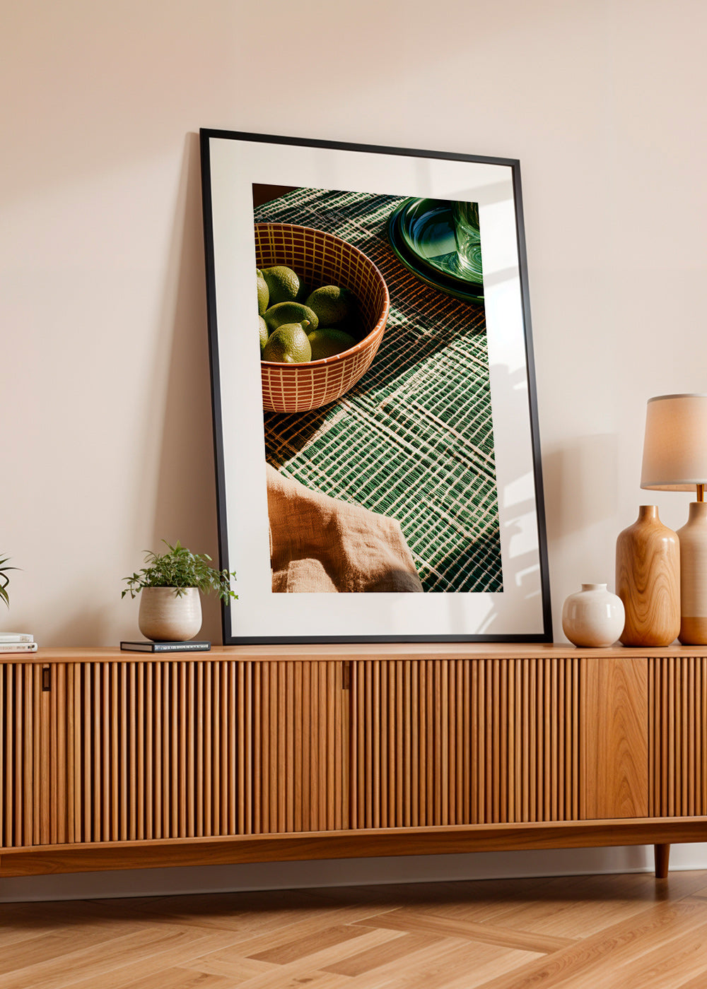 Kitchen art with limes in bowl and graphic cloth