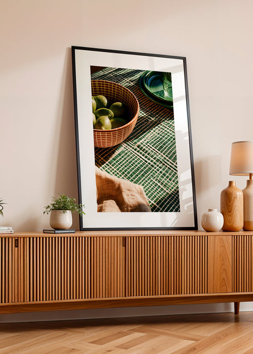 Kitchen art with limes in bowl and graphic cloth