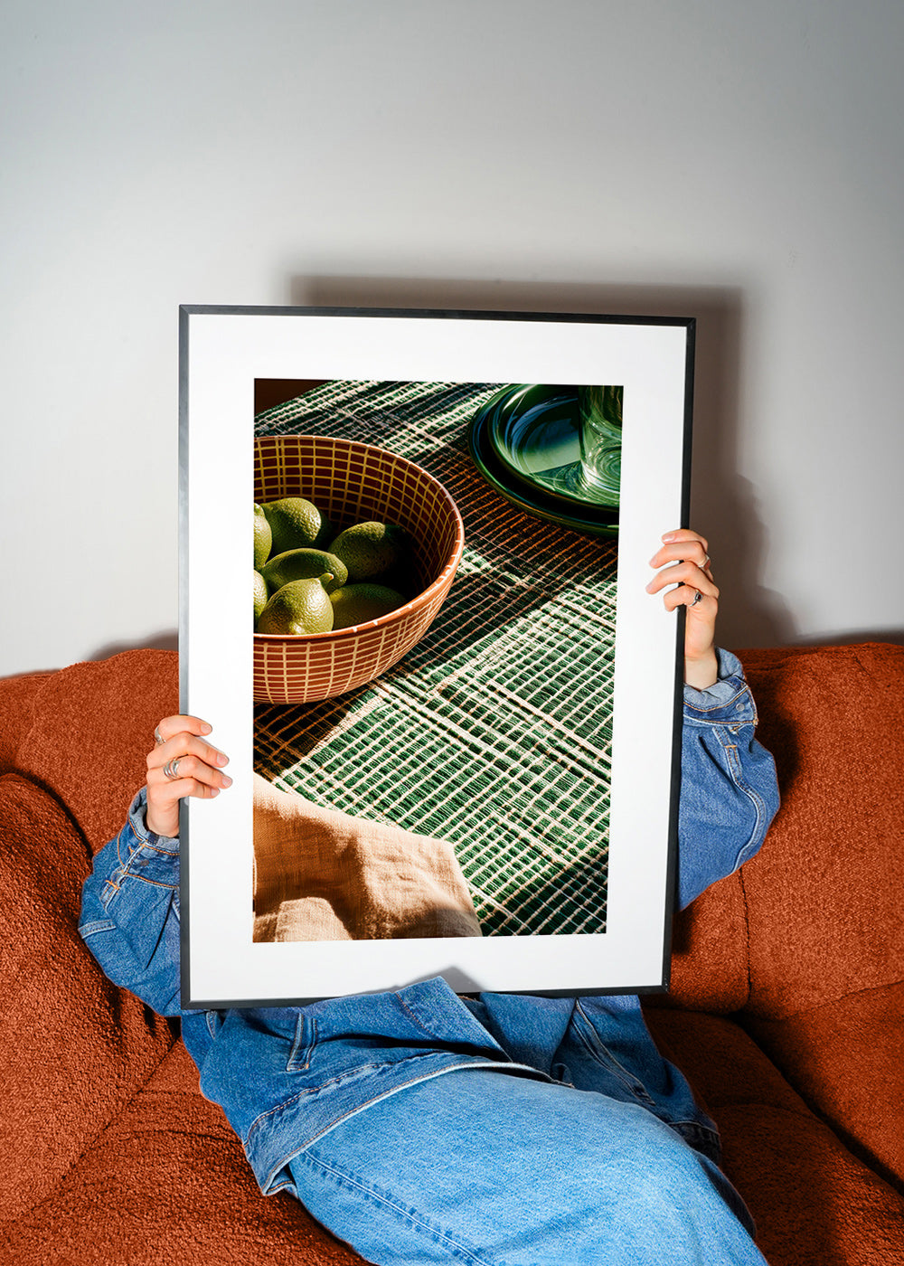 Kitchen art with limes in bowl and graphic cloth